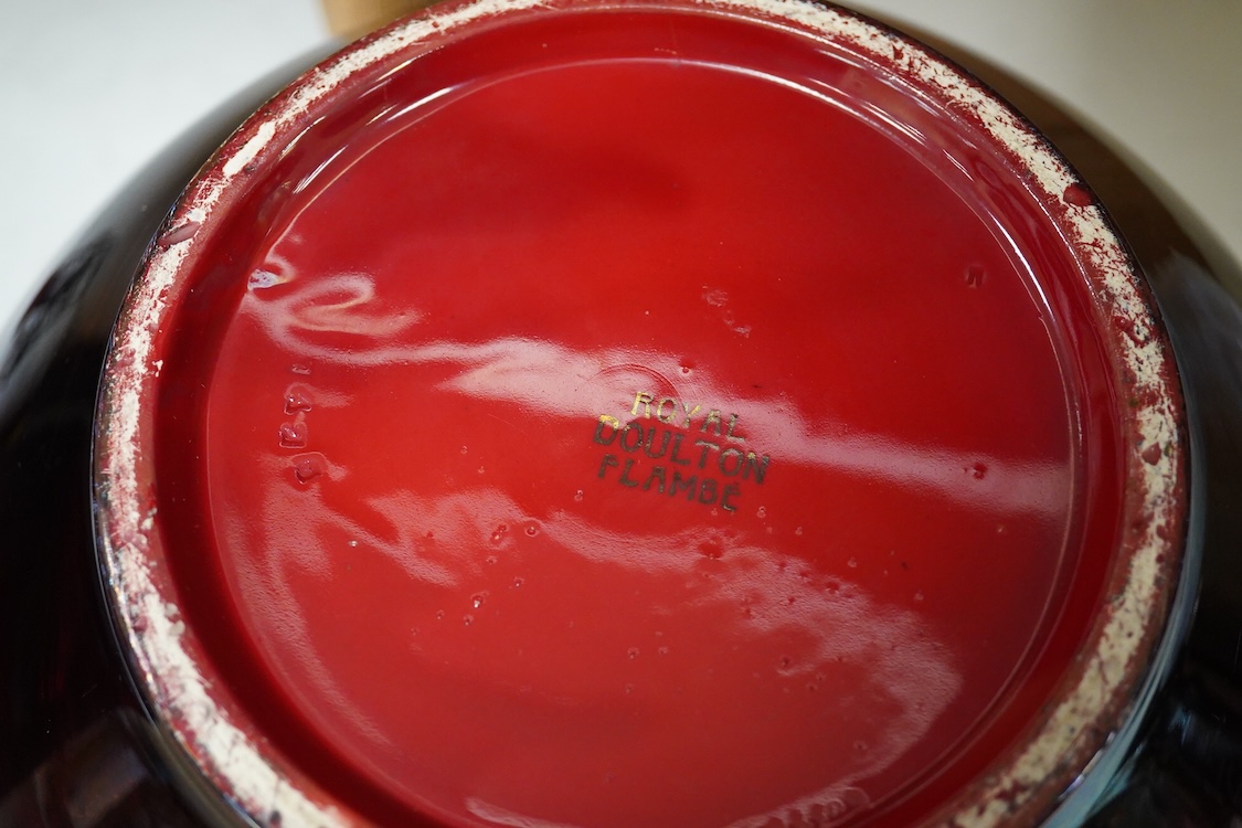 A large Doulton flambe vase decorated with ships, 29cm high